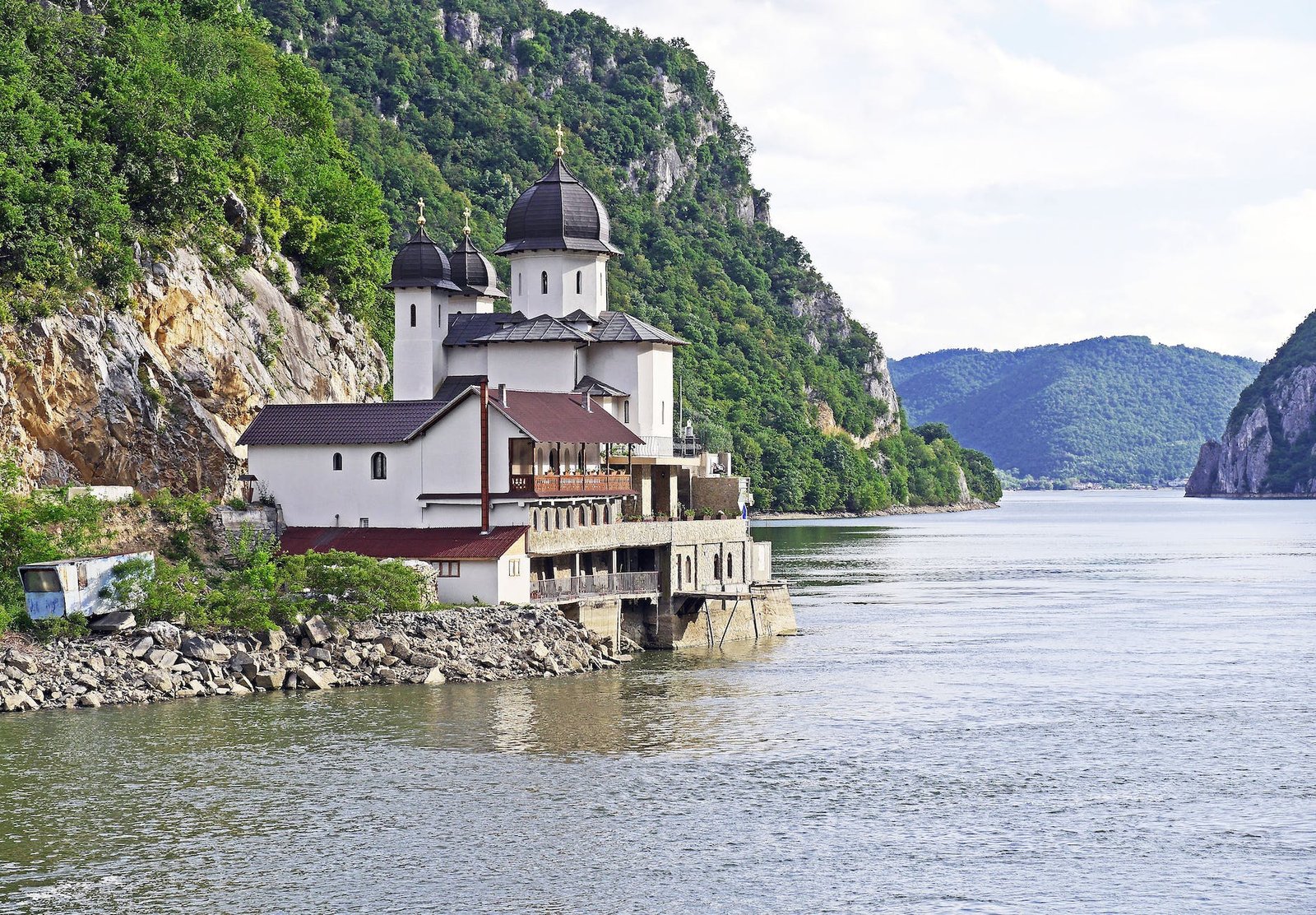 white and black house located at riverside - The Danube River