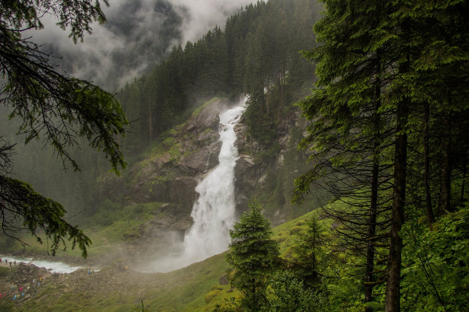 waterfall near trees - hiking in austria